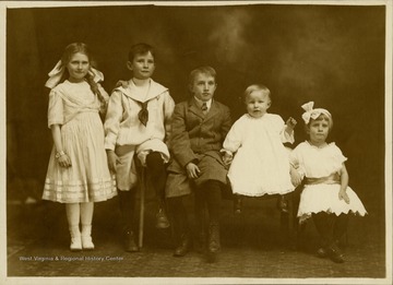 This image is part of the Thompson Family of Canaan Valley Collection. The Thompson family played a large role in the timber industry of Tucker County during the 1800s, and later prospered in the region as farmers, business owners, and prominent members of the Canaan Valley community.Ruth, Paul, Ben, Albert, and Avilda Thompson pose for a portrait