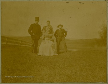 Albert Thompson is pictured on the left with three unidentified associates.Albert Thompson brought the Thompson family to West Virginia and Tucker County in the late 1800s with the booming timber industry, taking advantage of Tucker County's forests. He bought the J. L. Rumbarger Lumber company and established the Thompson Lumber Company, which later became the Blackwater Boom and Lumber Company.This image is part of the Thompson Family of Canaan Valley Collection. The Thompson family played a large role in the timber industry of Tucker County during the 1800s, and later prospered in the region as farmers, business owners, and prominent members of the Canaan Valley community.