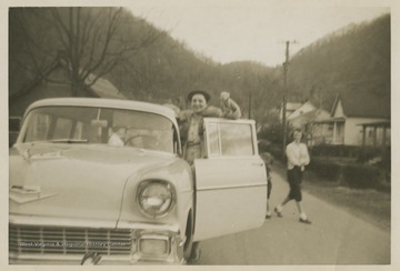 Williams holds up the keys to a brand new Chevy station-wagon, which was bought for basketball coach Roy Williams and his family by the East Bank High School fans.Jerry West led the East Bank High School basketball team to its first ever West Virginia state championship title in 1956. 