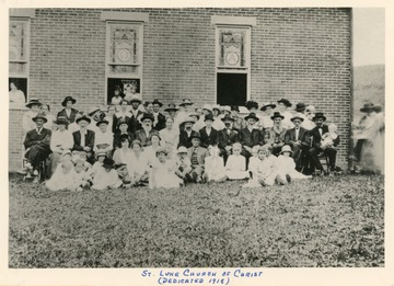 A group of church members sit for a portrait at the new building for St. Luke Church of Christ. The date the church was organized is unknown, but likely between 1860 and 1870.  A frame church was built in 1890 but destroyed by fire in 1913.  The name then changed to St. Luke Christian Church and a new building was erected in 1918. 