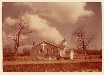 The church assembled in community members' homes before a building was built.  In 1900 the community erected the frame church.  It has since been replaced with a newer building.