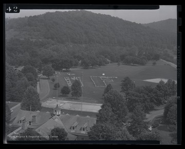 View overlooking a field in which girls of Rhododendron Girls State attempt to make letter formations. 