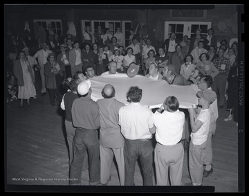 A group of Europeans play games at the leadership conference at the State 4-H Camp. Subjects unidentified. 