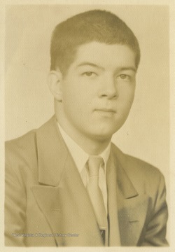 An unidentified high school student poses for a school photo. 