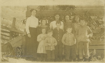 Grose is pictured with a group of unidentified school children. 