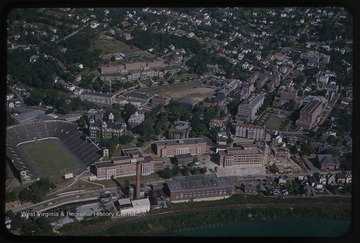 View overlooking Mountaineer Field and Woodburn Hall. Other university buildings seen are Chitwood Hall, Martin Hall, Woman's Hall (now Stalnaker Hall), Terrace Hall (now Dadisman Hall) the Armory Building, Mechanical Hall II, Brooks Hall, Arnold Hall, Armstrong Hall, Oglebay Hall, Clark Hall, Colson Hall, Elizabeth Moore Hall, Stansbury Hall, and the Downtown Library.