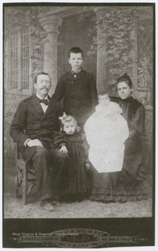 Pearl Sydenstricker Buck (small child at center) poses with her father, Absalom, mother, Caroline, her older brother, Edgar, and baby sister, Grace.