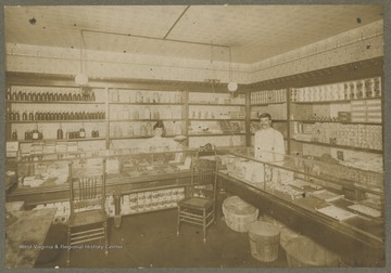 Interior of a general store, most likely in Morgantown, W. Va.  Items on the shelves include oatmeal crackers, candy, tobacco, and a variety of other canned, boxed, and bagged items.