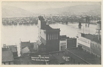 Photo postcard of Bridgeport, Ohio, and Wheeling Island during a flood. Postcard is part of a souvenir book of 1913 flood images.