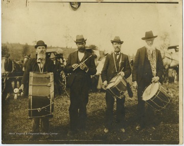 Pictured from left to right are Jacob Harsh (grandfather to Stanley Harsh and Ada Fitzwater); Aldernon Crim; Joseph L. Johnson (grandfather to Karl Myer); and Anthony Vannoy (grandfather to Marada Waddell).Band concerts were an important part of the entertainment at early fairs. This local band played at the first Street Fair, which was held yearly for 27 years.Jacob Harsh (b. 5/15/1839-d.4/21/1909) was married to Cinderillia Harsh (b. 3/7/1841-d.9/5/1925) and was brother to Samuel F. Harsh. 