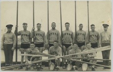 Kneeling in the front row, from left to right, is PFC Meihold; Private Grewohl; PFC Dunning; and Private Hayes.Standing in the back, from left to right, is Corporal Pop Winn Coxswain; PFC Rottier; Private Hill; CPL Marquez; Private Davis; Private McIntyre; PFC Shumacher; and 1st Lieutenant Davis. 