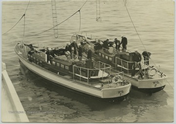 The motor boats were used to transport enlisted men to and from shore. 