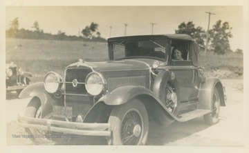 "Thrills! Front of Gore - Rather side. New 1930 Studebaker Coupe. Arthur Beaumont." Woman in car is unidentified, but is likely Hester Luetta Harr.
