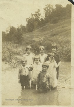 Juanita, pictured on the left standing, is with her friends Wilda, Ruth, Garlow, Virginia, Jo, and Bobbie. 