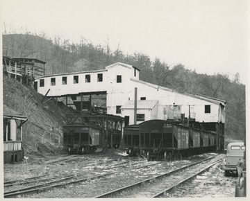 C. & O. Railway cars sit against the building, likely prepared to transport coal. 