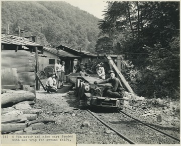 Coal miners sit in the railway cars to be transported to their work stations at the Cedar Grove Collieries Inc. & Supply Co. mine. 