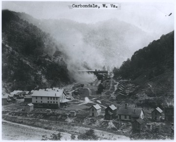 Smoke rises from a coal facility in Carbondale, W. Va., which is located in the valley between the mountains.