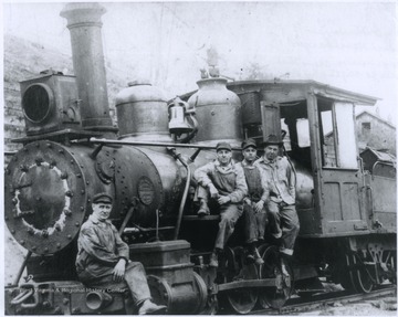 Men sit on the side of the locomotive. The Mann's Creek Railroad carried coal from the Babcock Coal and Coke Company in Clifftop, W. Va. to sawmills in Landisburg, Pa. 
