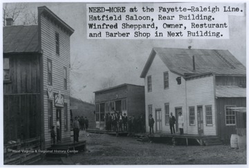 The town is situated on the Fayette County-Raleigh County line. In the rear is the Hatfield Saloon. A barber shop and restaurant are also pictured. Winfred Sheppard was the owner of one of these establishments and is also pictured. 