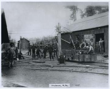 A group of coal miners are pictured around the by the mine's railway tracks. The mine, Prudence No. 1, was owned by the New River Coal Company.