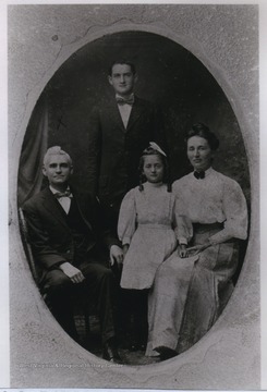 From Left to right are Hugh W. F. Amos, Frank Amos, Autumn Amos, and Mrs. Hugh Amos.Hugh W. F. Amos built the first telephone company in Central West Virginia, the Weston-Central. 