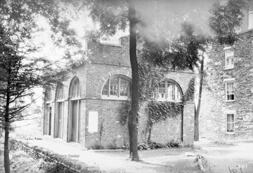 Photograph of the fort's exterior. It was built in 1848 as a guard and fire engine house for the federal Harpers Ferry Armory in Harpers Ferry, West Virginia, then a part of Virginia. Storer College was a historically black college. The fort was on the campus of Storer College from 1909 to 1968.