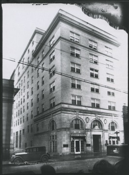The hotel is located on the corner of High and Moreland Streets.  A curtain in the left window advertises "Frocks & Hats."