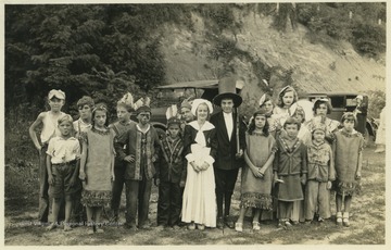 Children dressed as pilgrims and Native Americans are likely dressed for a Thanksgiving play. 