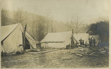 The tents are identified as "the Boers Nest" (left), "the Queen's Tent" (center), and "the office tent" (right).This photograph is found in a scrapbook documenting the survey for the Baltimore and Ohio Railroad in West Virginia and surrounding states. 