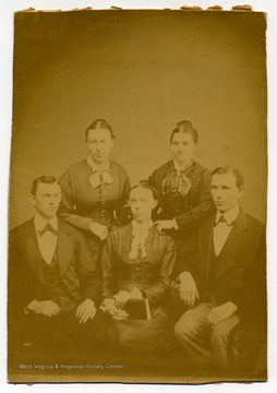 Family portrait of the Courtney Family.Front row left to right: Ulysses James Courtney, Arah Jame Courtney, Alpheus Fisk Courtney.Back row left to right: unidentified, Mary Emma Courtney.