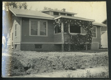 Outside of house No. 29 in Nitro, W. Va.This was one of the 1,724 "pre-cut" houses Minter Homes Corporation built in Nitro.The design of the layout was named the "Five-Room Executives Residence."