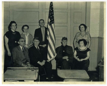 Veteran's Day annual ceremony at Canyon Grade School in Monongalia County, W. Va.Back row standing L to R: Mrs. Russel (Margaret "Leona") Turner, unidentified, Joseph Lyons (principal), and Mrs. Sylvia (Arnold) Stafford.Sitting L to R: first three are unidentified, and Miss Virginia Stafford.