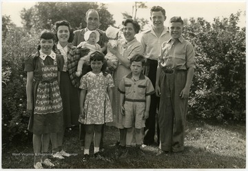 Portrait of the MacDonald Family from Berkeley County, W. Va.  The MacDonald family likely acted as a model family for Extension Service advertisements.