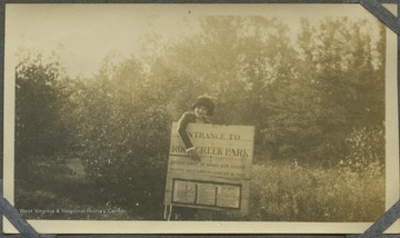 Unidentified woman at the entrance of the Rock Creek Park. 