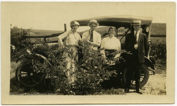 Left to Right: Unidentified, unidentified, Lucy Satterfield, Ulysses L. Nuzum.