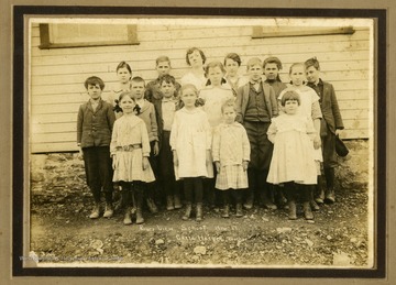 Children of River View School. Carrie Harper Harman, teacher, is in the back row, fourth from the left.