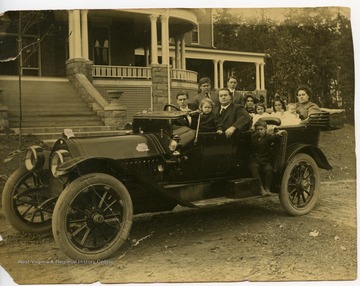 Seymour Harper family in car, parked in front of the Independent Order of Odd Fellows home in Elkins, W. Va.
