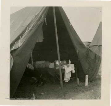 Man resting in tent number 22.