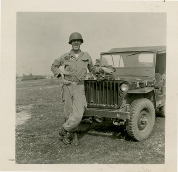 Giles stands in front of Jeep.