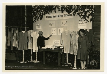 Signs read: "Dresses For Every Occasion; Party or church; Other articles made by 4th year club members."