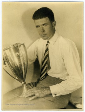 Carl B. Allen, an alumnus of WVU, with "Sportsman Pilot" Cup won in 1930 at the Chicago Air Races. 