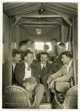 C. B. Allen and nine other reporters in the interior of the Sikorsky Aerial Pullman "Yorktown," piloted by Chas G. Collyer.  C. B. Allen is pictured in the rear, fifth from the left.