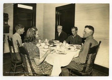 Williams family having dinner in their Doddridge County, W. Va. home.