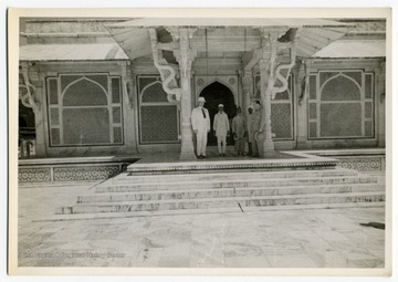 Colonel Louis Johnson and Colonel Griffith with Indians at the tomb of Sheik Salim Chisti at Fatehpur Sikri, India. 