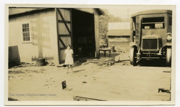 Back of photo reads: "Bus Garage at Henlawson, Logan County, in which the superintendent of the mine set up a gas stove so that I might demonstrate there." 