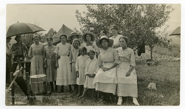 "A small group of club girls start work in canning." 