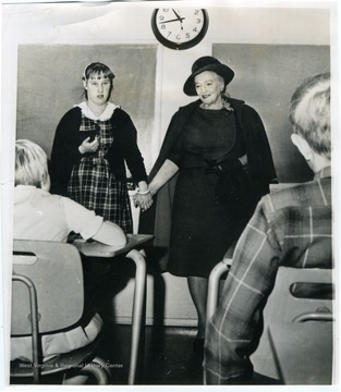 Text on back reads, "Author Pearl Buck, an old 'China hand,' visits Pearl Buck School, Eugene, Wednesday. The private institution is 12 years old, helps retarded children. It was Miss Buck's first visit since the school organized."
