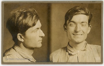 Mugshot of Blackhand group member Frank Cingotti. He is smiling.The back of the image contains sections in which to fill out identifying information on the subject. The filled out sections read:Name, Frank CingottiCrime, Felonious wounding with intent to kill. (W.Va)