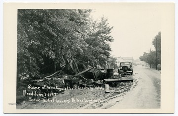 Text reads, "Scene of wreckage after Petersburg, W. Va. flood June 17 1949. Scene back of Tanners, Petersburg, W. Va."