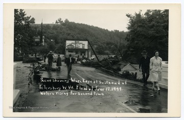 Text reads, "Scene showing wreckage at south end of Petersburg, W. Va. Flood of June 17 1949. Waters rising for the second time."